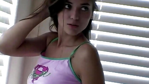 Sexy petite teen strips off for the camera
